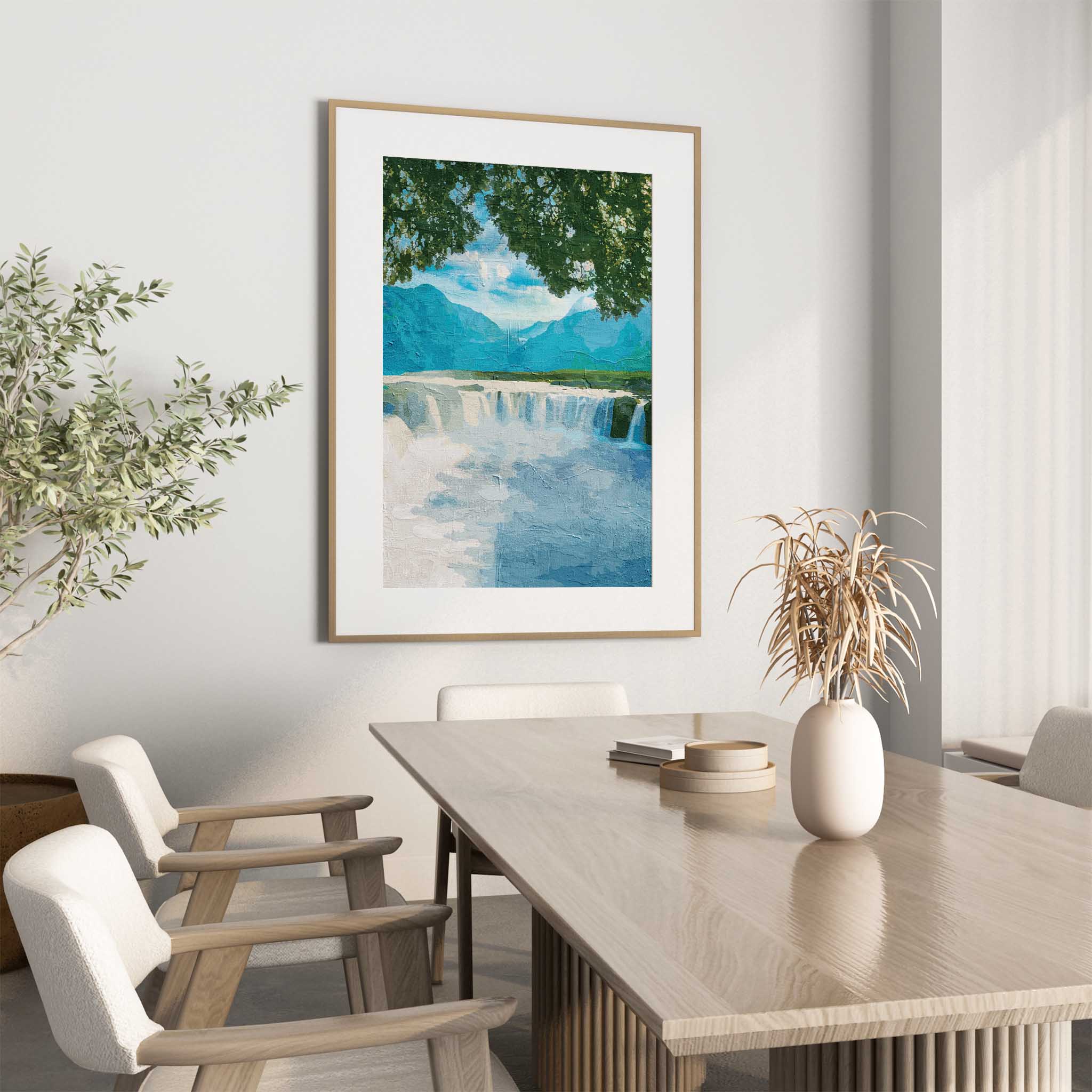 Tranquil waterfall wall art featuring a wide, gentle cascade framed by leafy tree branches, with distant blue mountains and a peaceful sky creating a calming nature scene