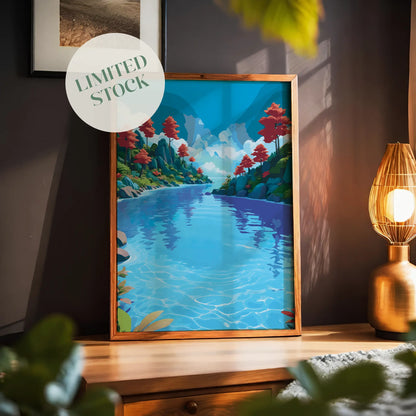 Vibrant landscape wall art of a clear blue river flowing between green hills with red trees and a bright sky filled with fluffy clouds