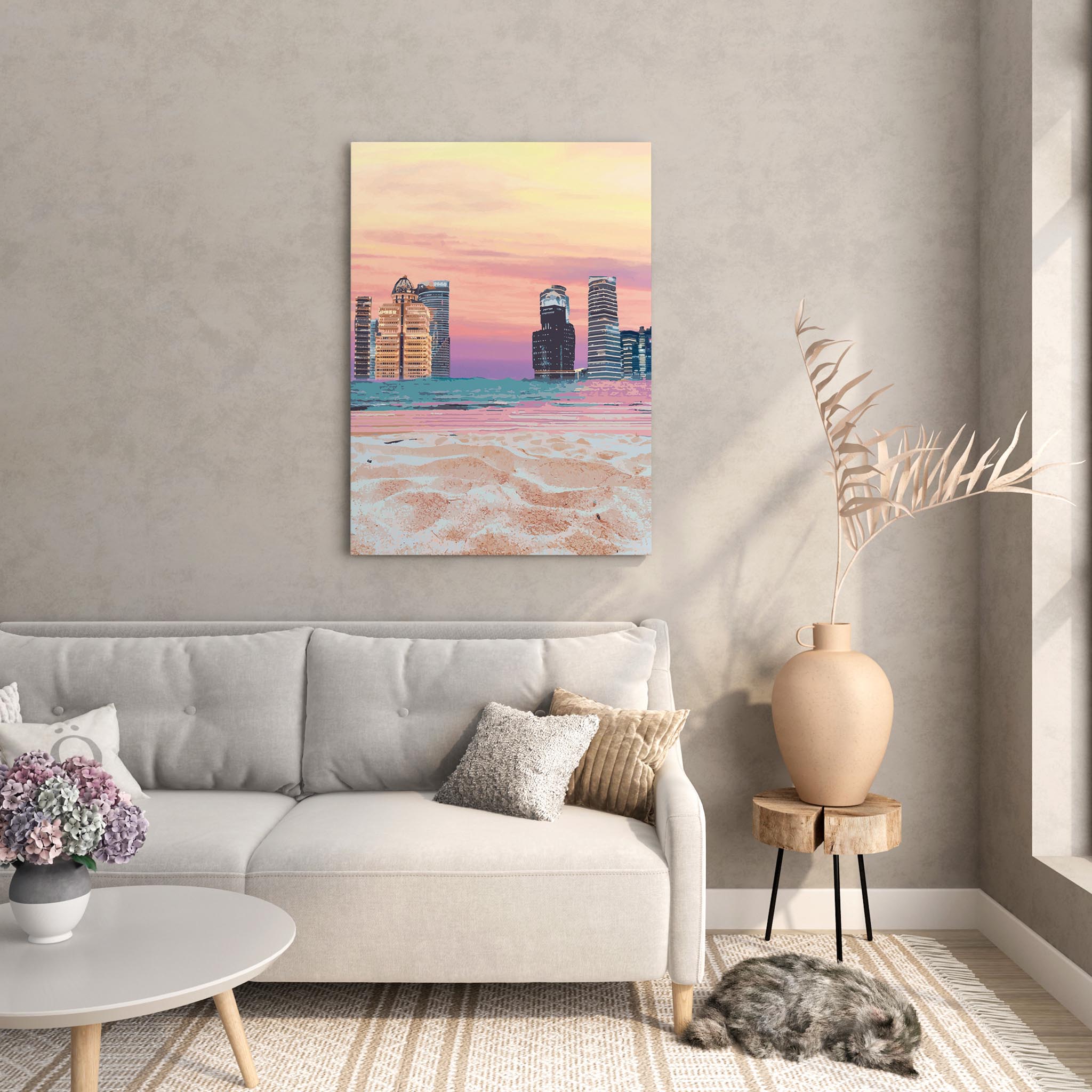 Modern cityscape wall art featuring futuristic skyscrapers along a beach shoreline, with soft sand in the foreground and a vibrant pastel sunset sky blending shades of pink, orange, and purple