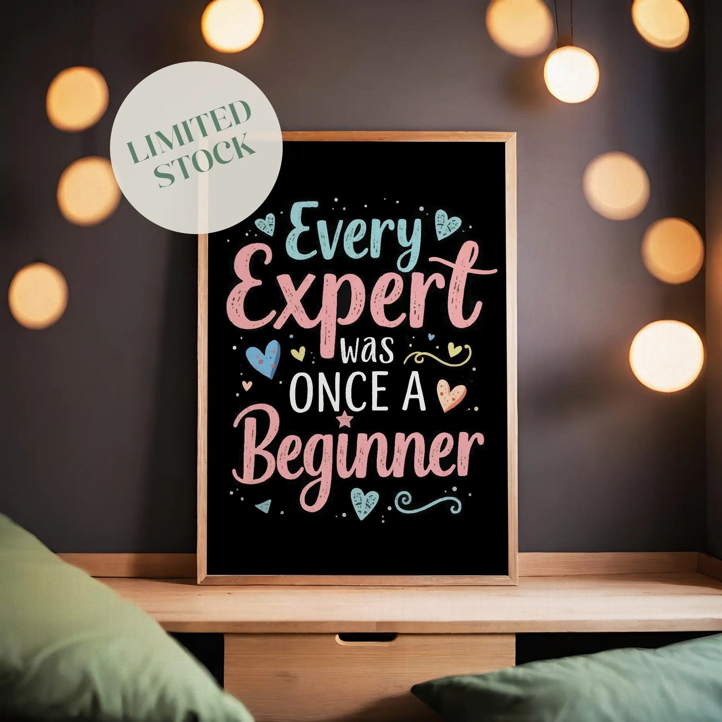 Motivational printable wall art featuring the quote 'Every Expert Was Once a Beginner' in playful pastel typography with decorative hearts and swirls on a black background, perfect for inspiring home offices, classrooms, or creative spaces