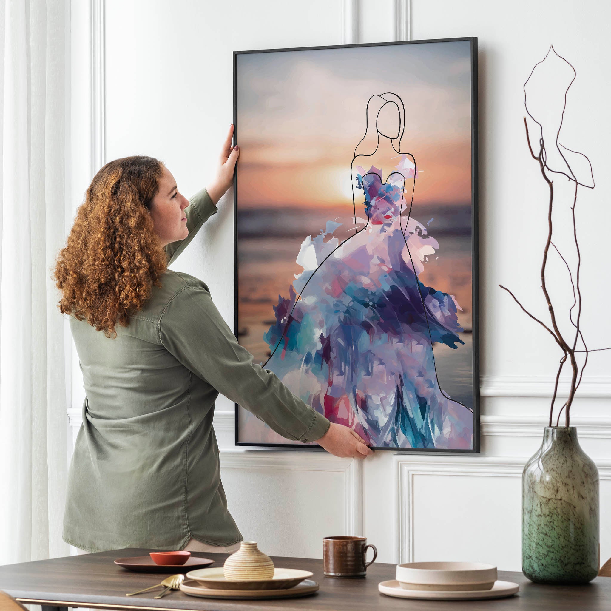 Elegant printable wall art featuring a minimalist line drawing of a woman in a flowing, abstract watercolour gown with vibrant purples, blues, and pinks, set against a serene sunset beach background, perfect for modern, fashion-inspired interiors