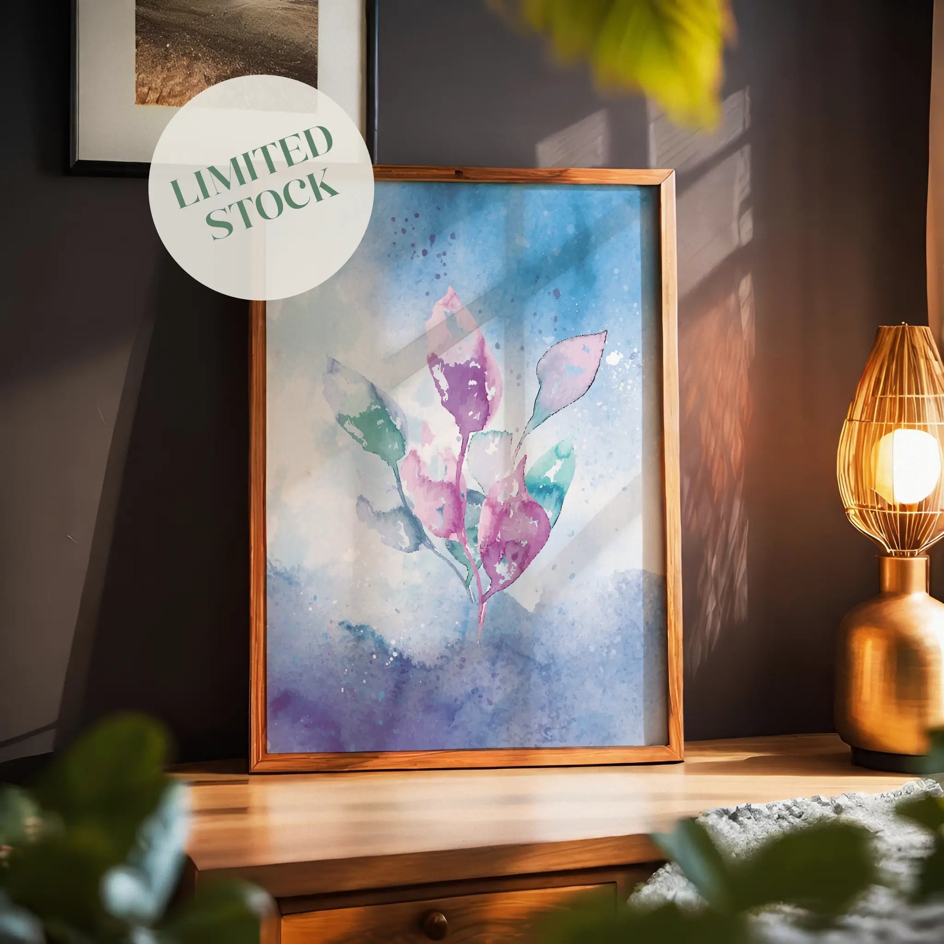 Watercolor illustration of delicate pink, purple, and green leaves on a dreamy blue and violet background, abstract botanical printable wall art for modern, tranquil interiors.