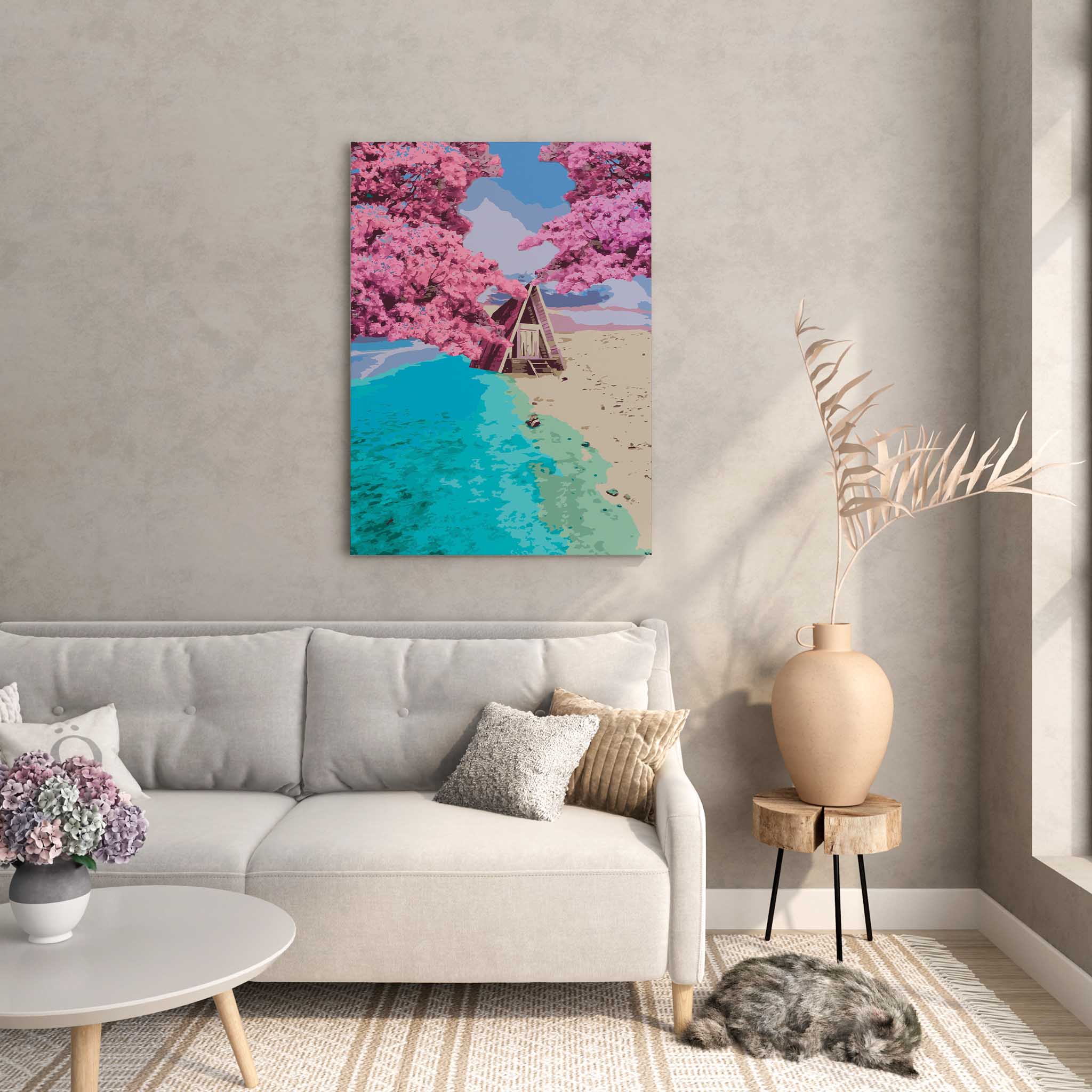 Whimsical beach cabin wall art featuring an A-frame hut nestled between turquoise ocean waves and golden sand, framed by blooming pink cherry blossom trees under a pastel sky
