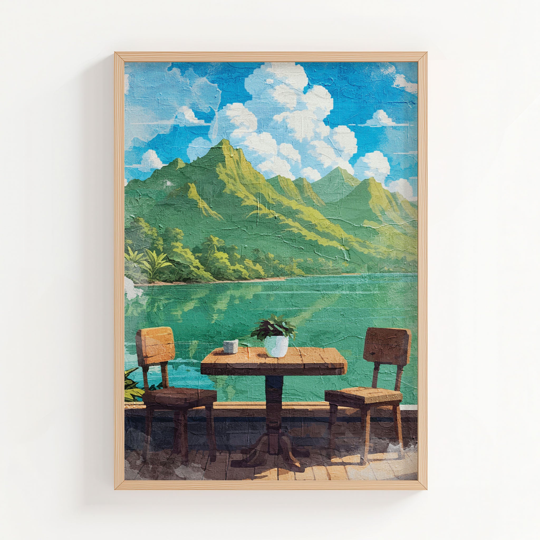 Tropical lakefront printable wall art featuring a rustic wooden table with two chairs overlooking calm turquoise water and lush green mountains under a bright blue sky with fluffy clouds - perfect for vacation-inspired, outdoor dining, or serene nature-themed decor