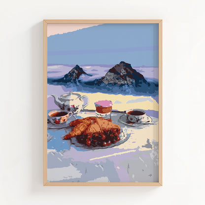 Cozy printable wall art of a serene alpine breakfast scene featuring croissants, tea, and coffee with a majestic mountain backdrop, perfect for kitchen or café-inspired decor