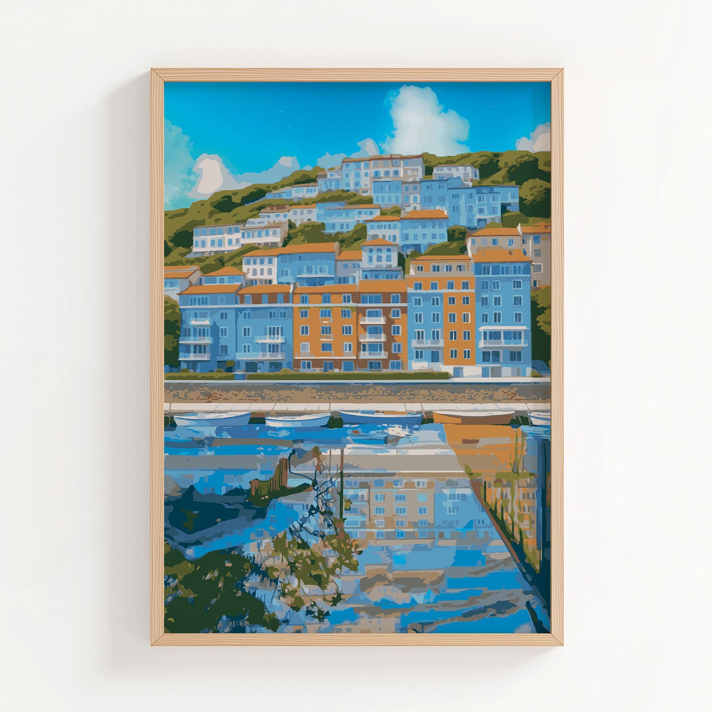 Coastal cityscape wall art showcasing colorful hillside buildings in shades of blue and orange, reflected in a calm waterfront marina with small boats and a bright blue sky overhead