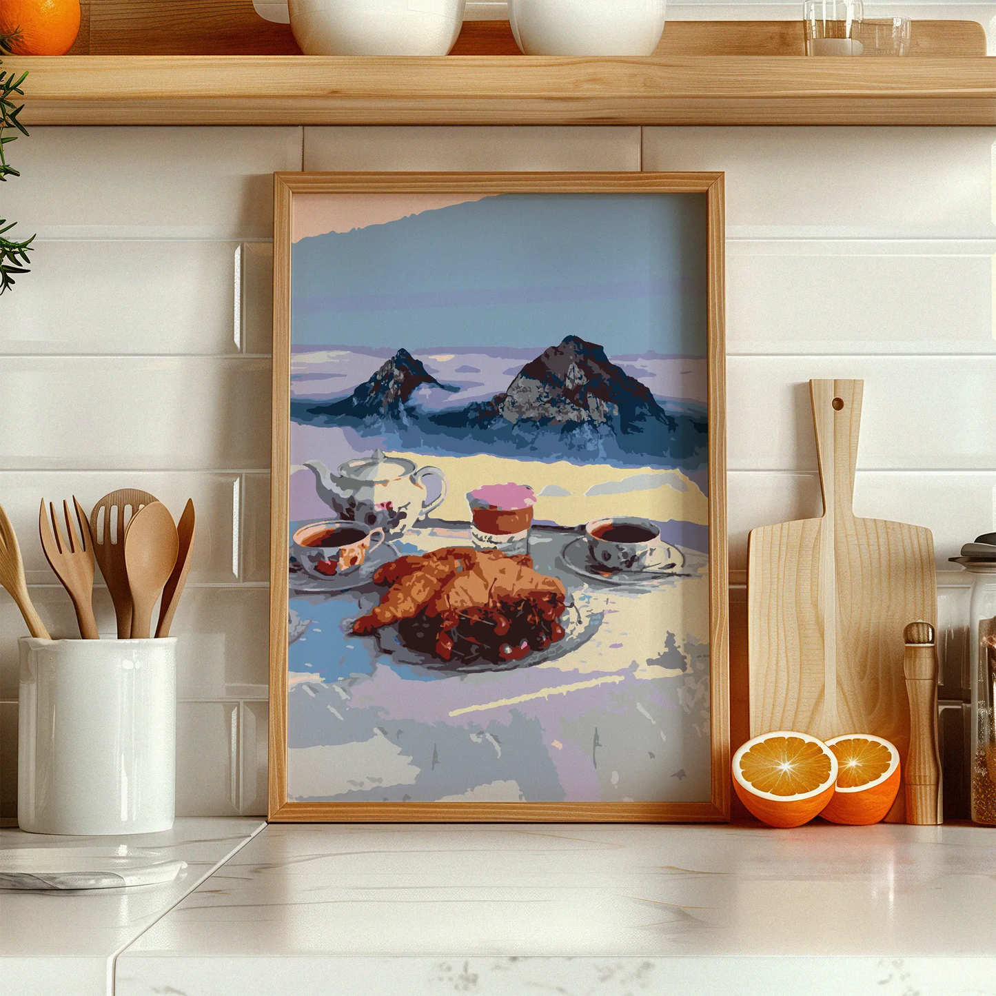 Cozy printable wall art of a serene alpine breakfast scene featuring croissants, tea, and coffee with a majestic mountain backdrop, perfect for kitchen or café-inspired decor