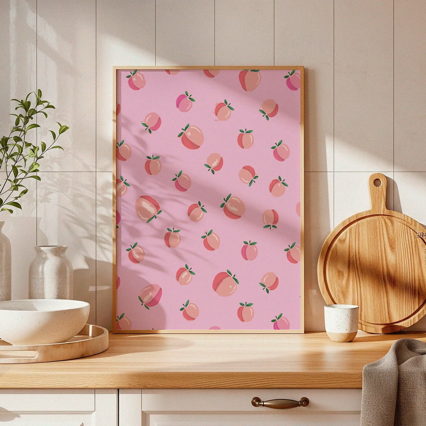 Playful pink wall art featuring a seamless pattern of illustrated peaches with green leaves, perfect for kitchens, nurseries, or fruity-themed decor