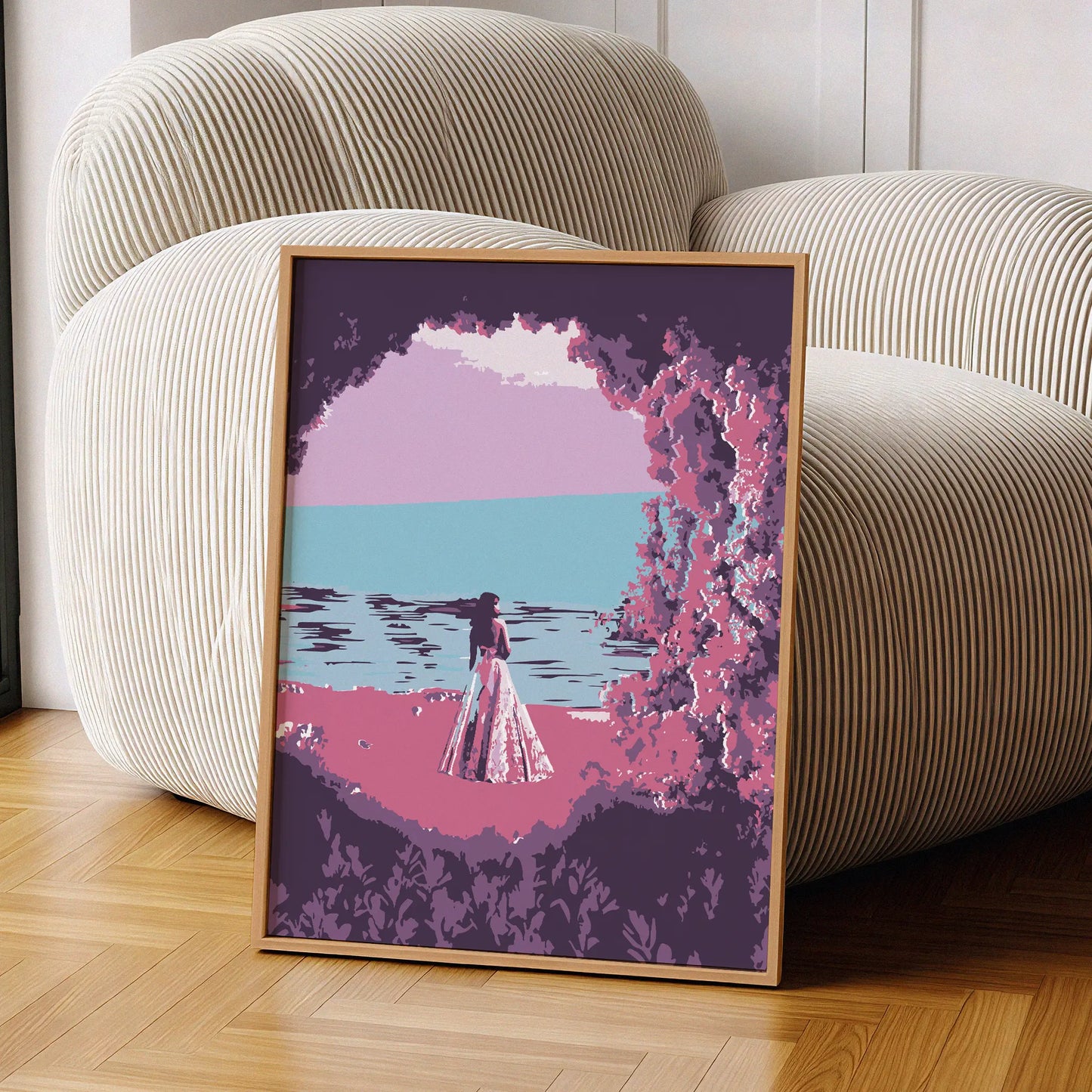 Dreamy beach wall art featuring a woman in a flowing dress standing by the ocean, framed by pink and purple foliage, with a calm sea and pastel sky creating a serene, romantic atmosphere