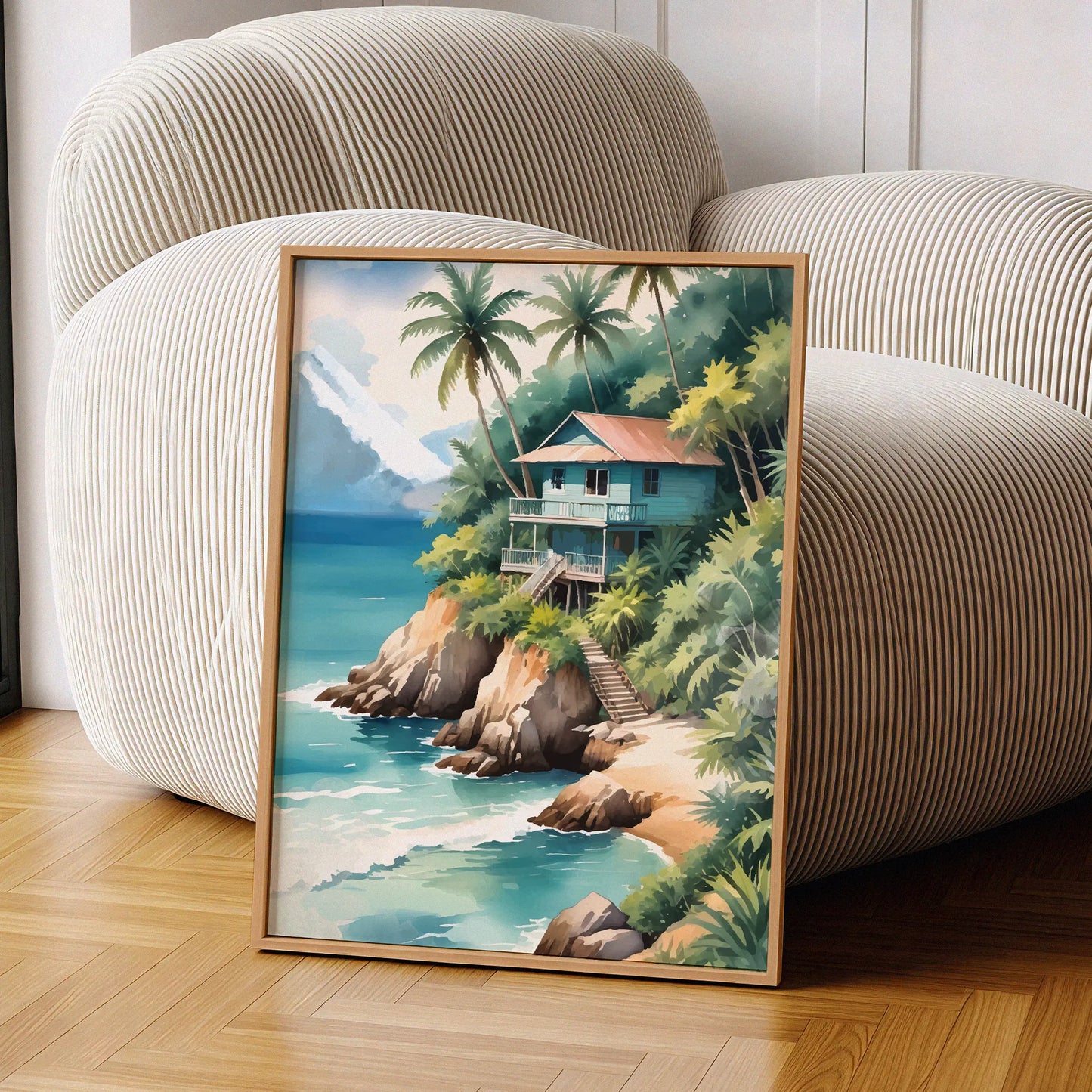 Tropical beach wall art of a wooden house on a cliff surrounded by palm trees, overlooking turquoise ocean waves with mountains in the background
