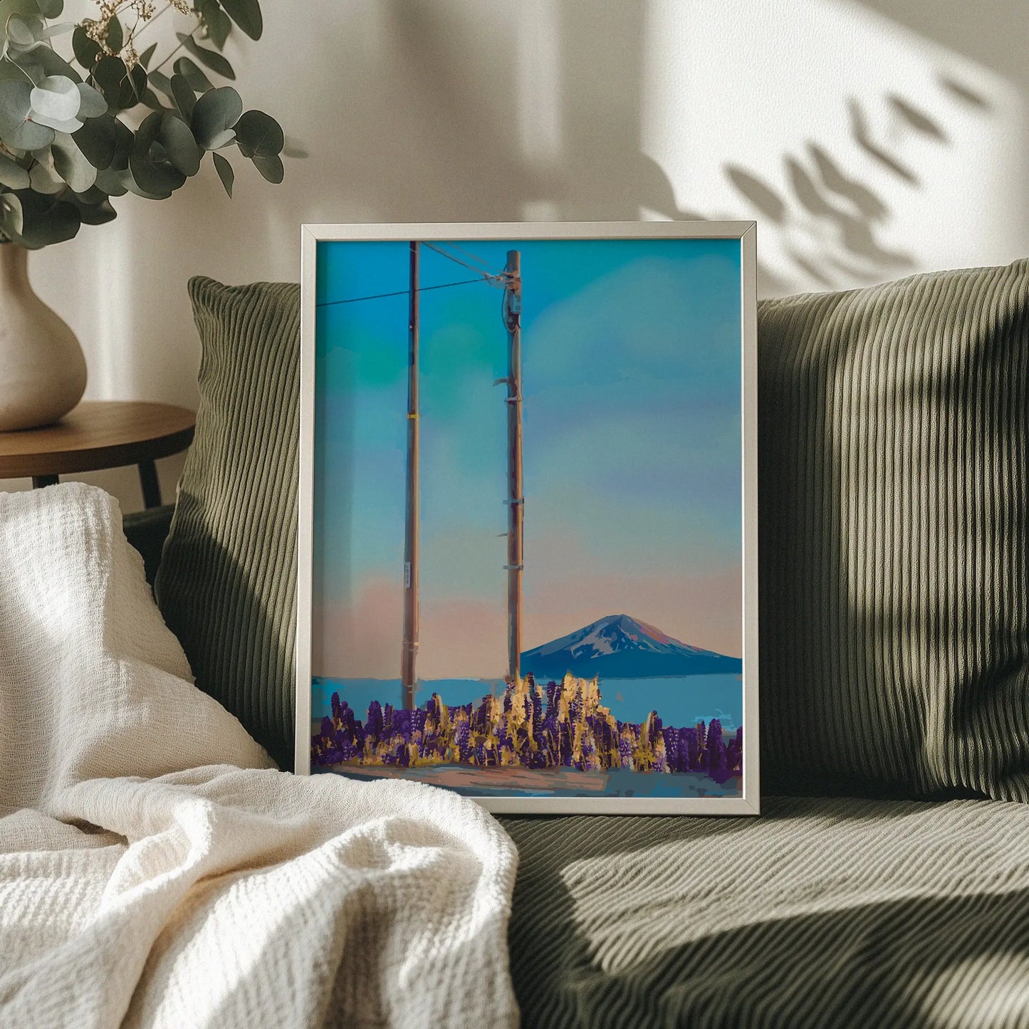 Minimalist mountain wall art featuring two wooden utility poles in a field of golden and purple wildflowers, with Mount Fuji in the distance under a soft pastel sunset sky