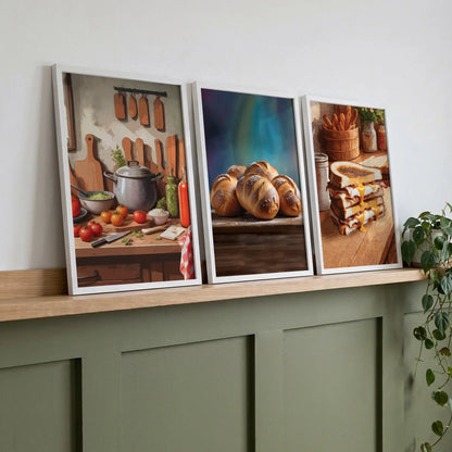 Set of 3 printable kitchen wall art prints featuring a rustic cooking scene with fresh vegetables, golden chocolate-stuffed buns on a wooden table, and a stack of gooey grilled cheese sandwiches, perfect for adding warmth and flavour to your kitchen or dining space