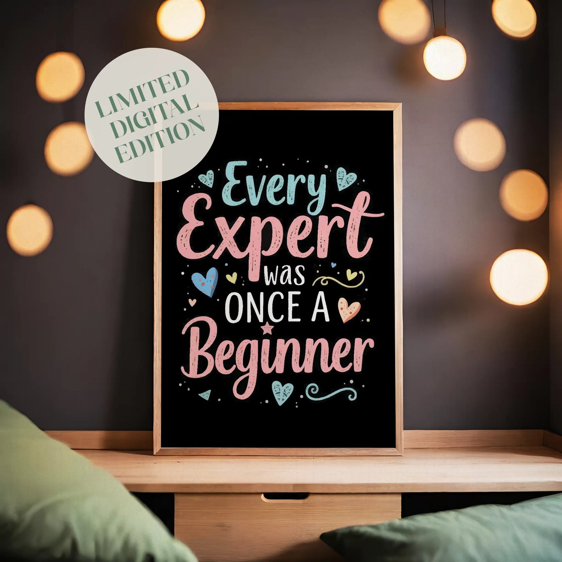 Motivational printable wall art featuring the quote 'Every Expert Was Once a Beginner' in playful pastel typography with decorative hearts and swirls on a black background, perfect for inspiring home offices, classrooms, or creative spaces