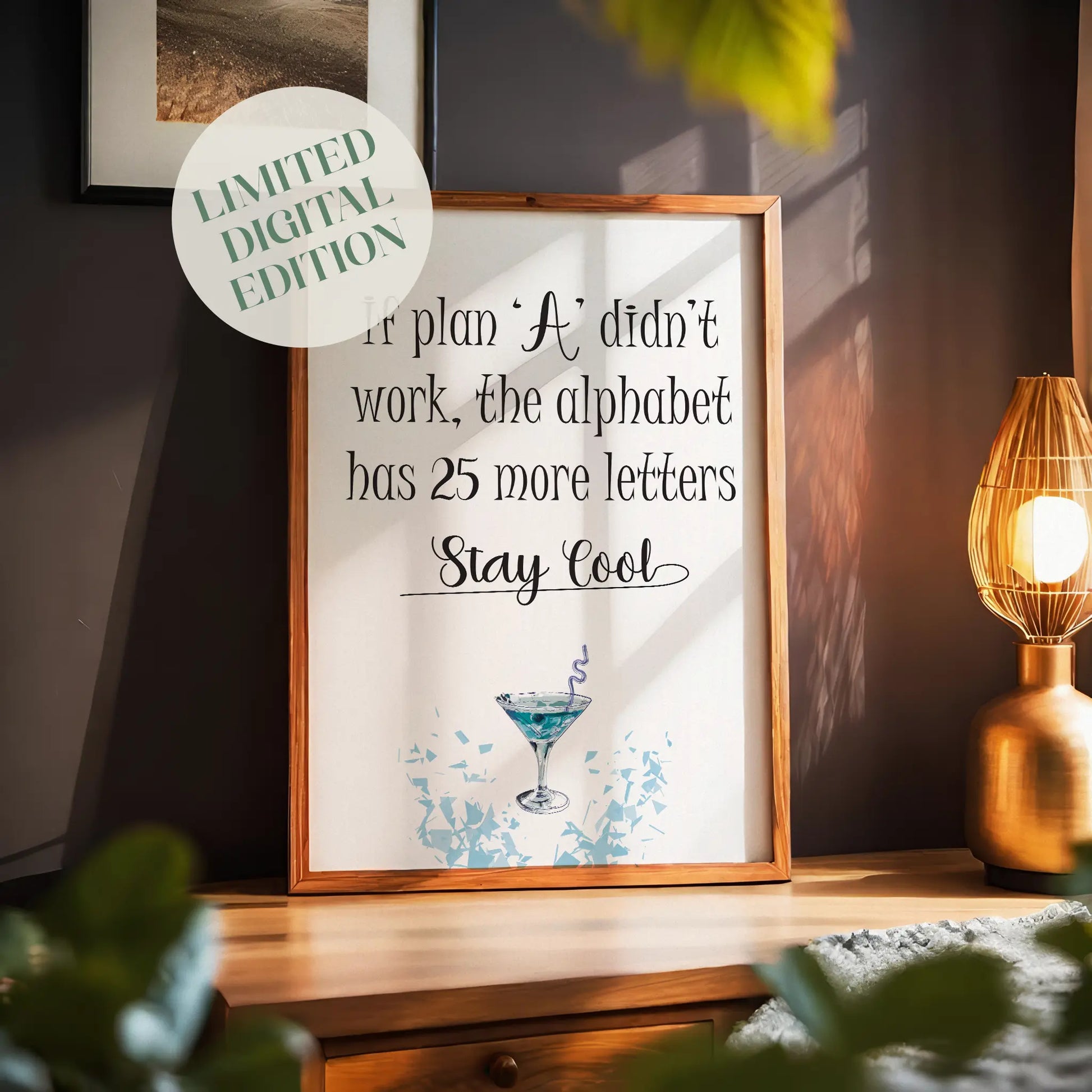 Motivational wall art print with playful typography that reads, "If plan ‘A’ didn’t work, the alphabet has 25 more letters. Stay Cool." Features a stylish blue cocktail illustration with ice cube graphics, perfect for modern or quirky home and office decor.