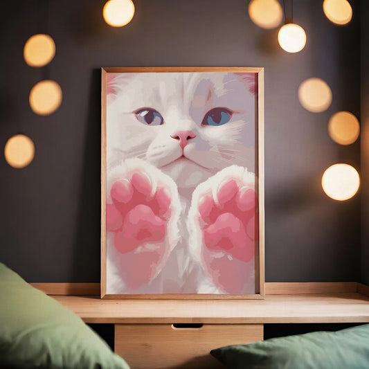 Printable wall art of an adorable white kitten with bright blue eyes and soft pink paws held up close, perfect for cat lovers and cute, whimsical home decor