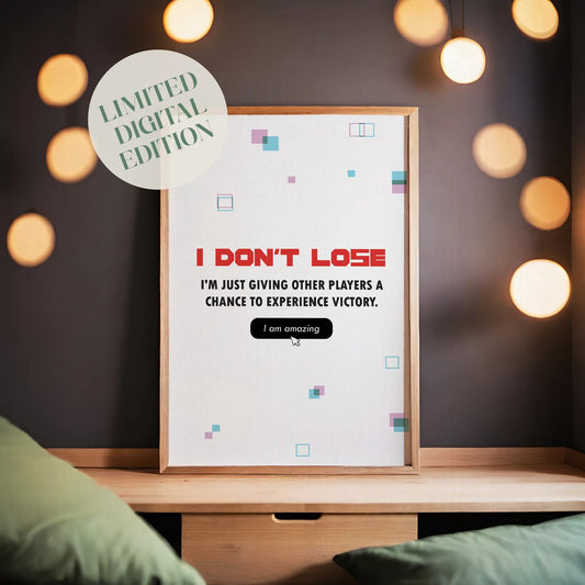 Funny gaming quote wall art stating ‘I don’t lose, I’m just giving other players a chance to experience victory’ in bold gamer typography with playful geometric accents - ideal decor for gaming rooms and streamers